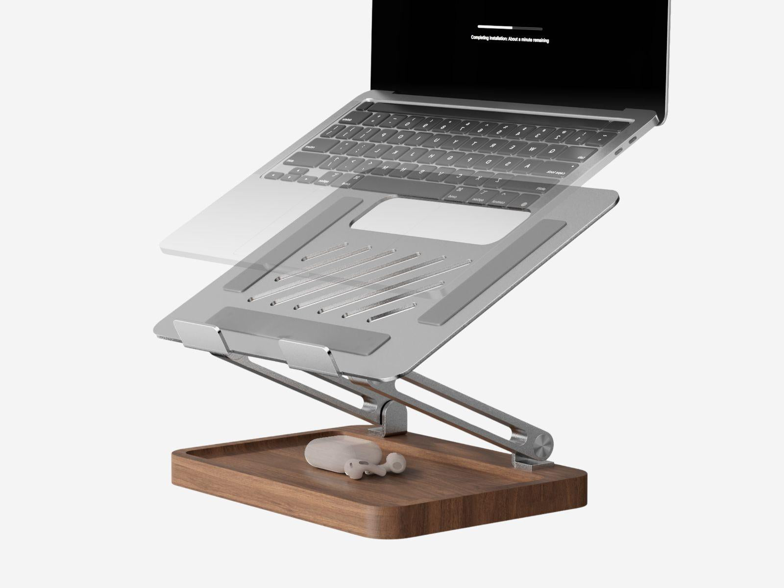 Adjustable walnut and aluminum laptop stand on a desk